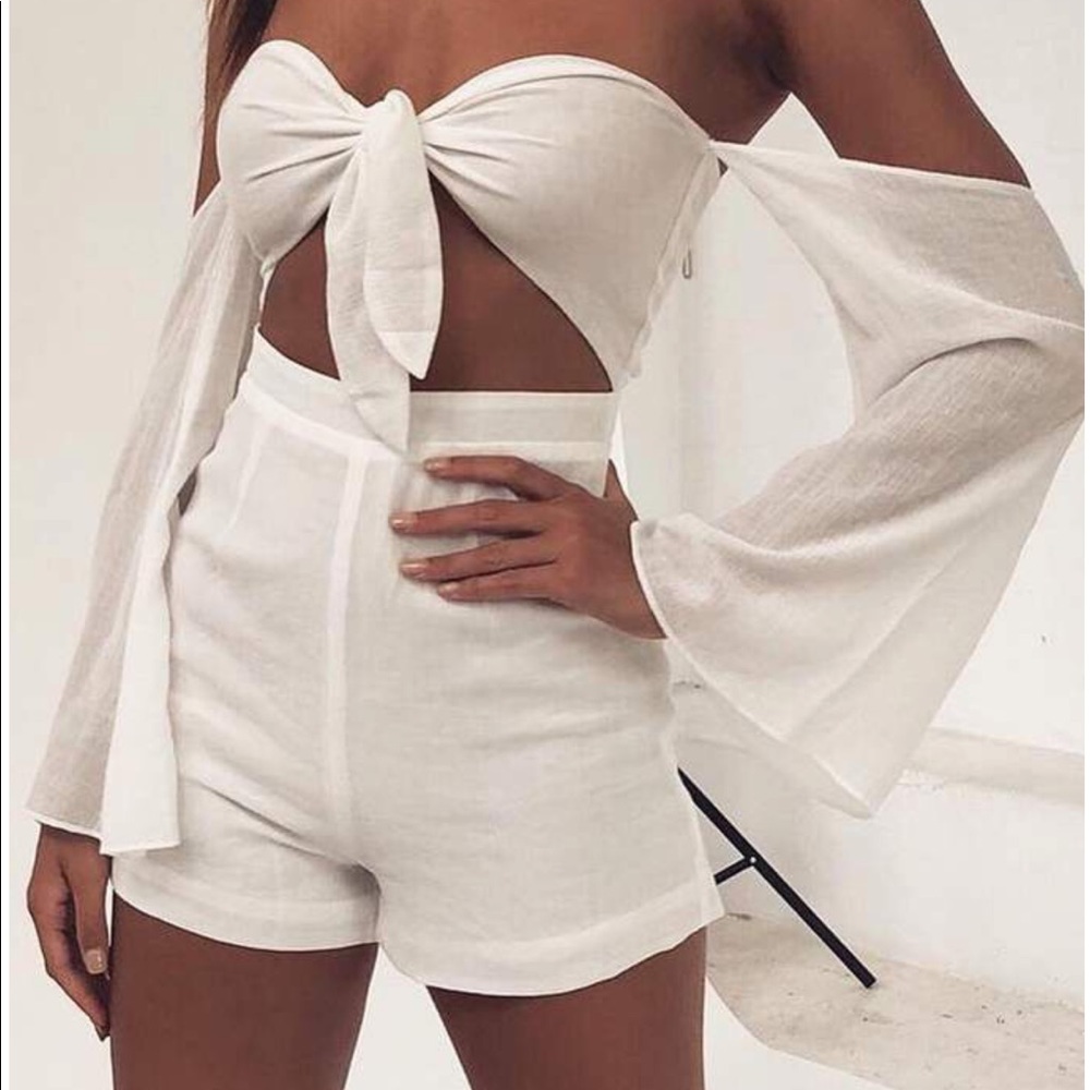 Brand new white play suit from Meshki.